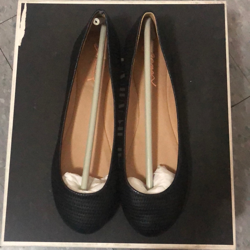 Black faux leather flats